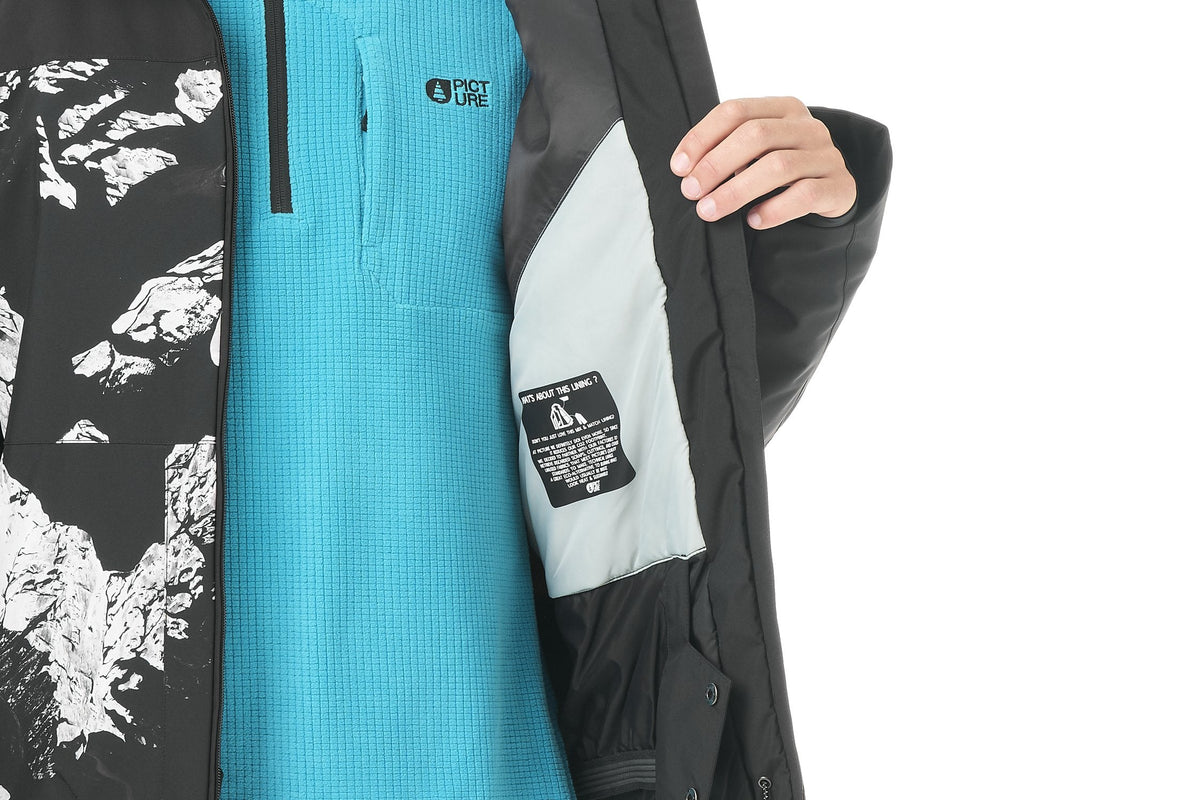 Picture Organic Clothing ski jacket worn open over a fleece mid layer