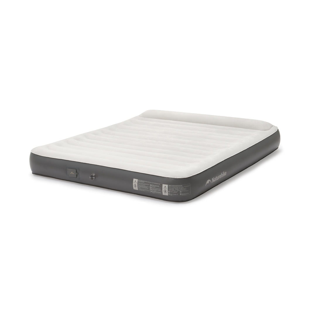 An inflatable bed with a built-in pump, displayed in a flat, expanded state, predominantly in a gray color with a white pillow on top.