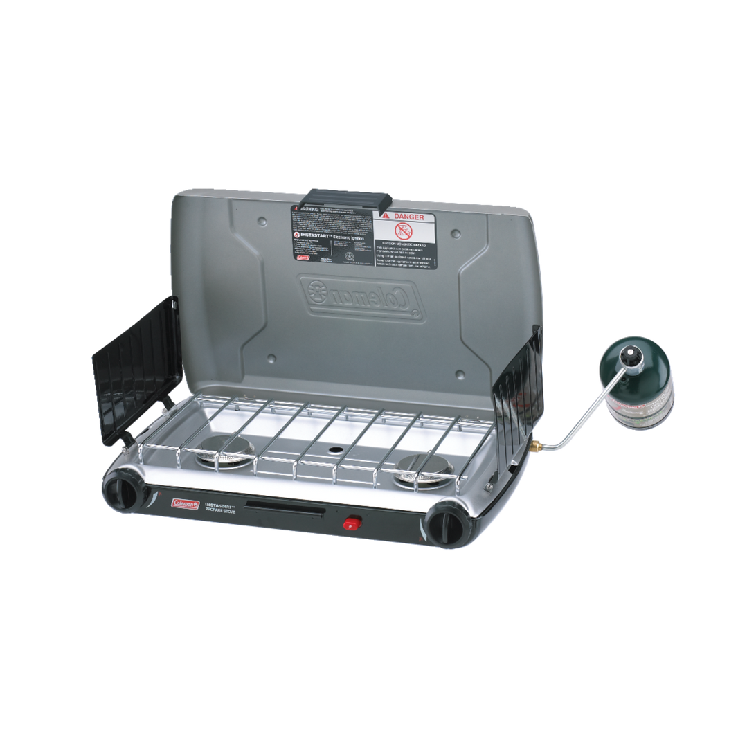 Coleman 2 Burner Triton Series Stove, open, with two burners and a windscreen.