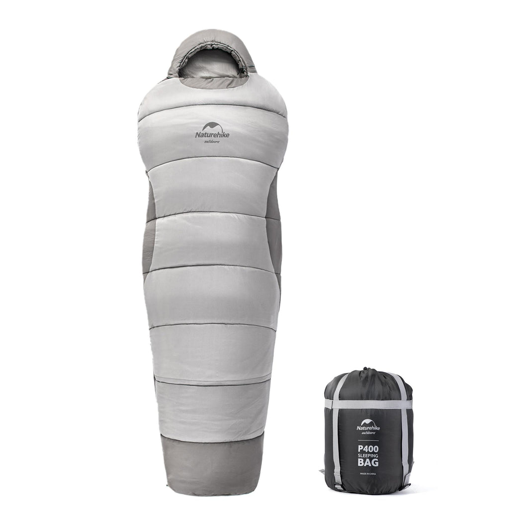 A gray Naturehike mummy cotton sleeping bag displayed next to its carrying bag.