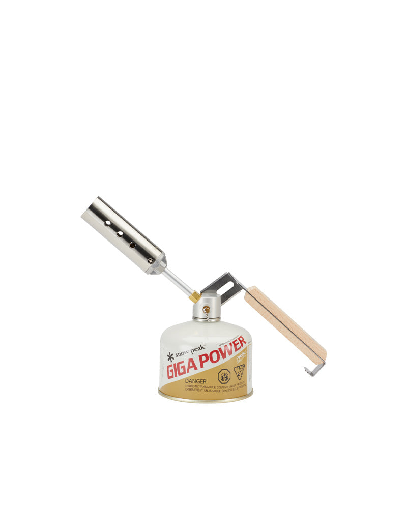 Snow Peak Folding Torch GT-120 mounted on a GigaPower gas canister, beech handle extended, white studio background