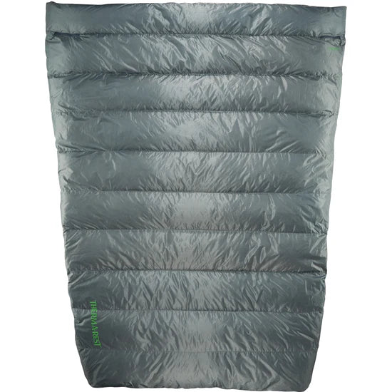 Green sleeping bag on a white background