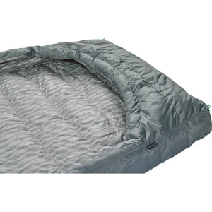 Gray sleeping bag with wave pattern on a white background