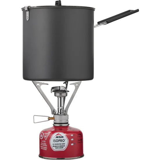 Camp stove with black pot and red fuel canister on white background