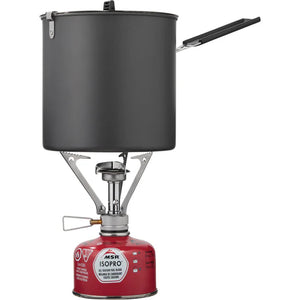 Camp stove with black pot and red fuel canister on white background
