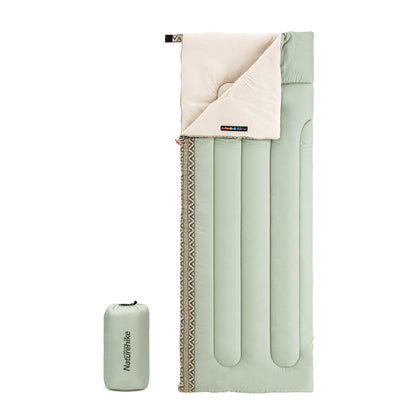 A light green rectangular sleeping bag with a beige interior visible at the top. The sleeping bag is shown alongside its carrying case.