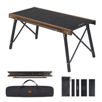 A foldable camping table with a black tabletop and aluminum frame, shown both assembled and folded, including a carrying case.
