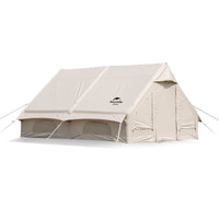 Khaki inflatable tent with a solid white interior, featuring a zipper and window or door, set up outdoors.