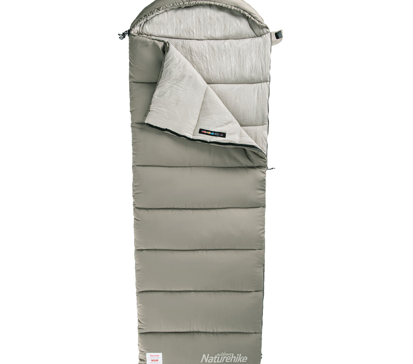 A green rectangular sleeping bag with a hat attached at the top, branded 'Naturehike'.