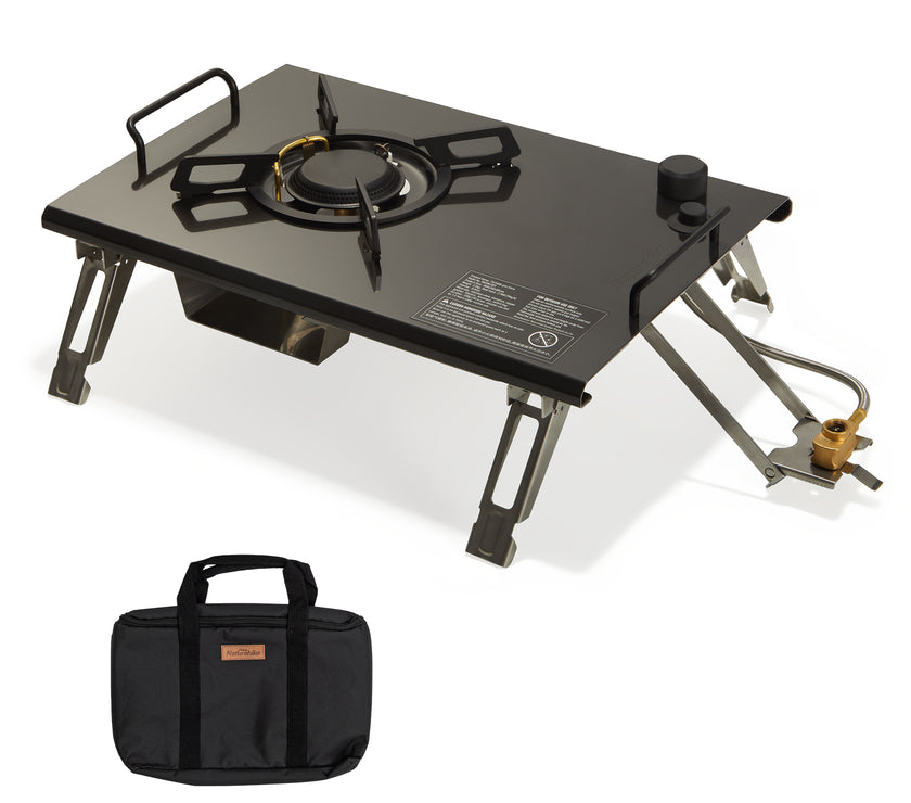 A black Naturehike G01 tabletop folding single head gas furnace with a stainless steel body, displayed alongside its carrying case.