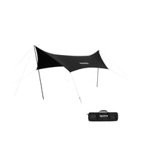 A black tarp set up outdoors with a carrying case lying in front.