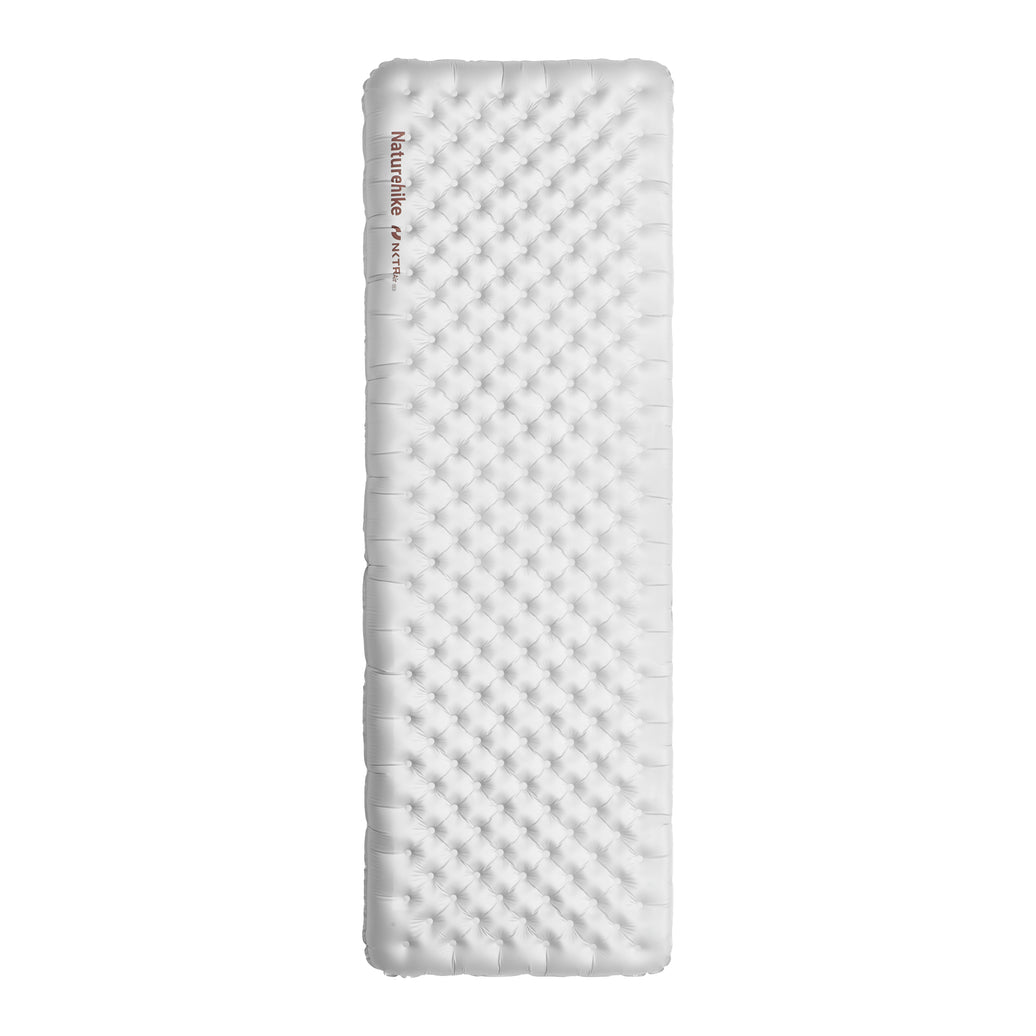 An inflatable square sleeping pad with a textured surface, predominantly white in color.