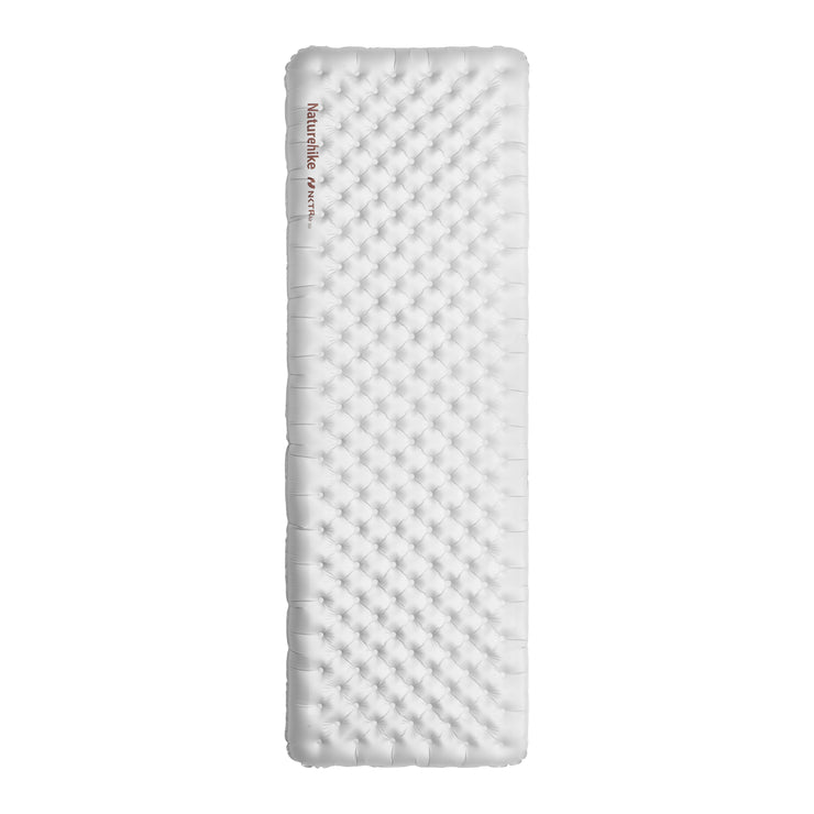 An inflatable square sleeping pad with a textured surface, predominantly white in color.