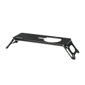 A black portable three-burner gas stove with a semi-unit grate and foldable stand, compatible with IGT tables.