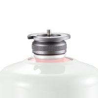 A close-up image of a silver butane stove adapter with a magnetic lock system, attached to a white cylindrical container.