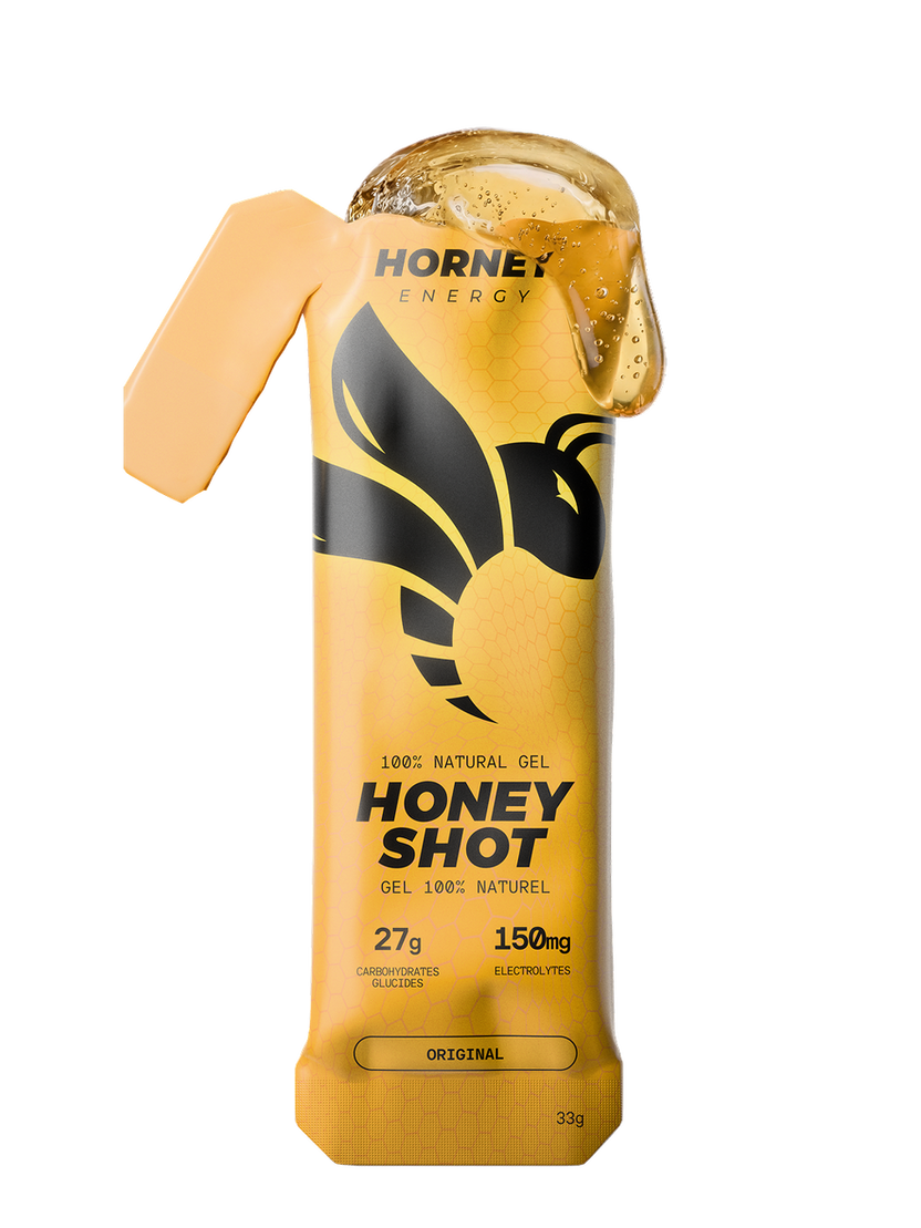 Hornet Energy Honey Shot energy gel sachet in Original flavour, 33 g, showing 27 g carbohydrates and 150 mg electrolytes.