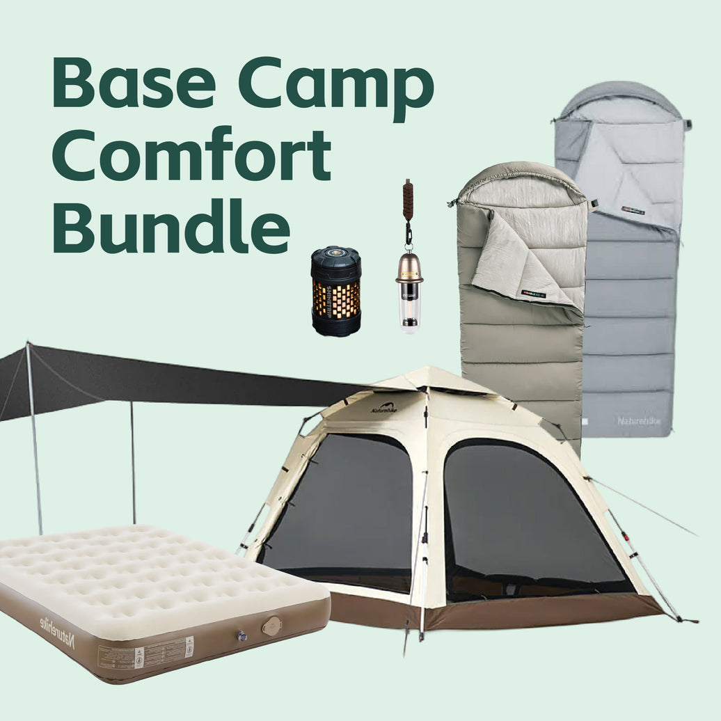 Basecamp Comfort Bundle: Naturehike Ango 4 automatic tent with its canopy extended, a built-in-pump air mattress, two hooded cotton sleeping bags in green and grey, a ShineTrip lantern and a hanging 2-in-1 camping light.