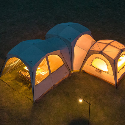 Two connected tents with warm lighting on a dark outdoor setting, labeled 'DIY Ultimated Connectivity'.
