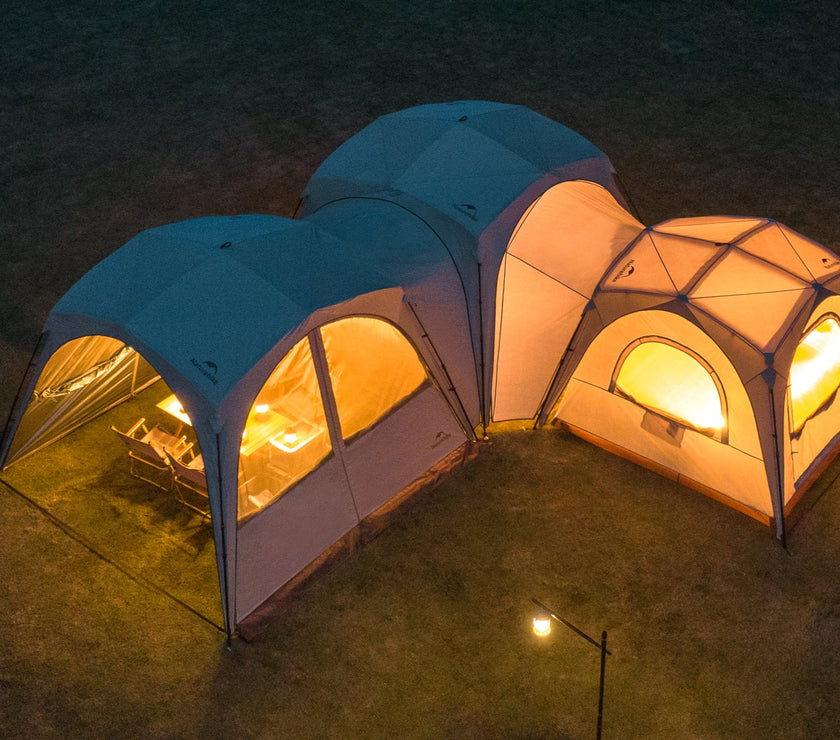 Two connected tents with warm lighting on a dark outdoor setting, labeled 'DIY Ultimated Connectivity'.