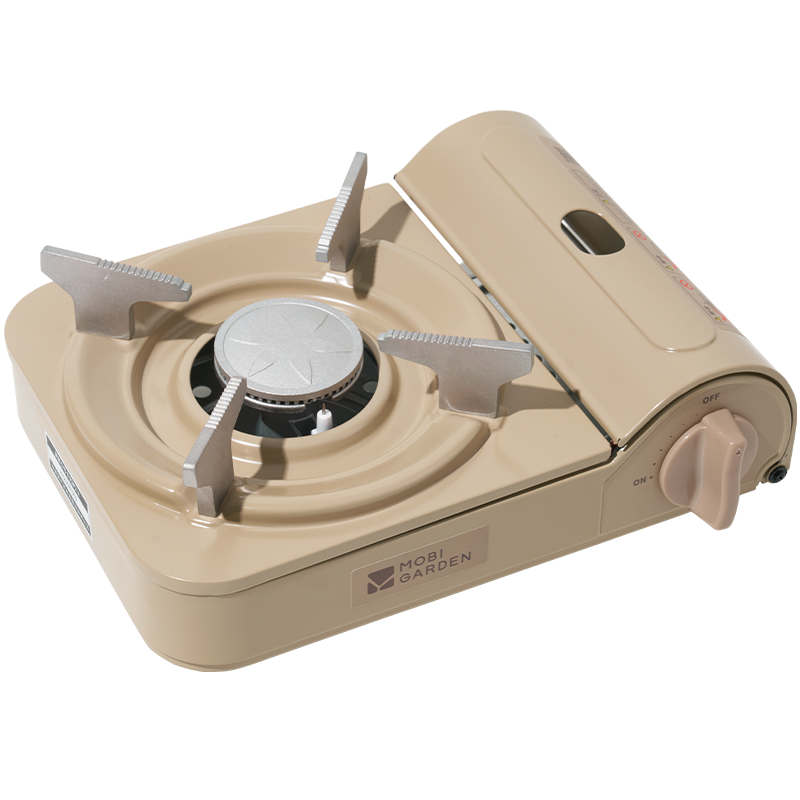 A portable gas stove in beige color with a visible brand logo on the front.
