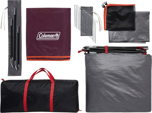 Collection of camping gear including a Coleman branded tarp, stakes, and carrying bag on a white background.