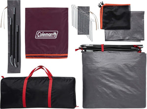 Collection of camping gear including a Coleman branded tarp, stakes, and carrying bag on a white background.