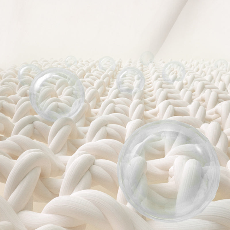 Close-up of white textured surface with clear silicone cups embedded