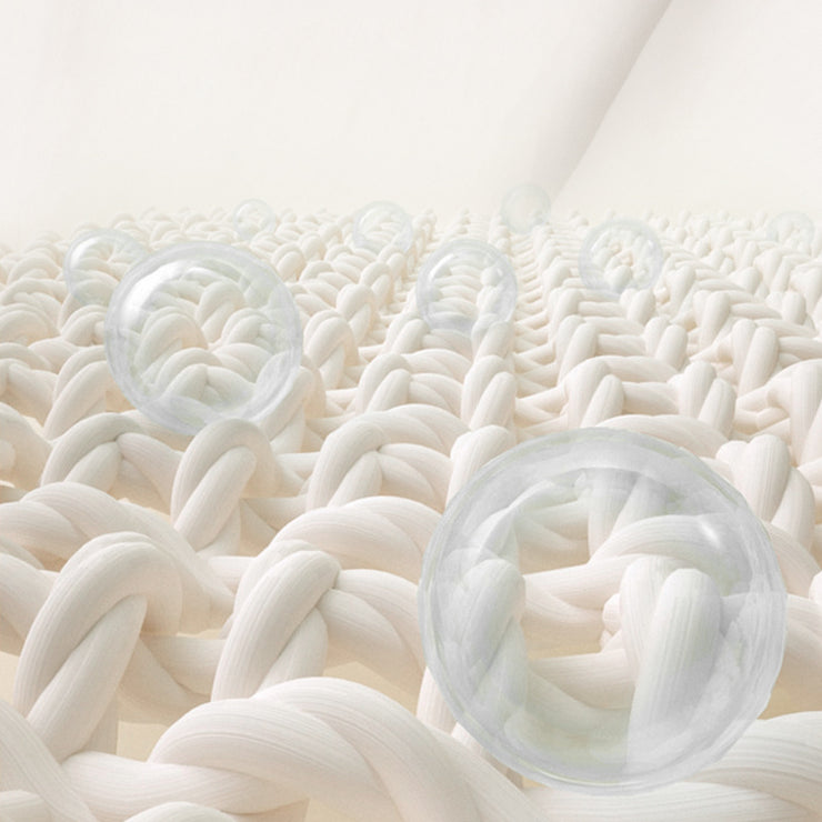 Close-up of white textured surface with clear silicone cups embedded