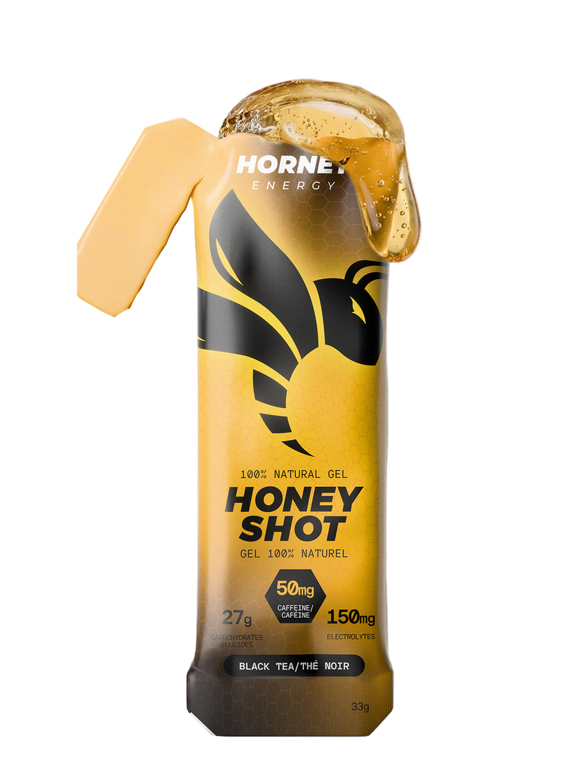 Hornet Energy Honey Shot energy gel sachet in Black Tea flavour, 33 g, showing 50 mg caffeine and 27 g carbohydrates.
