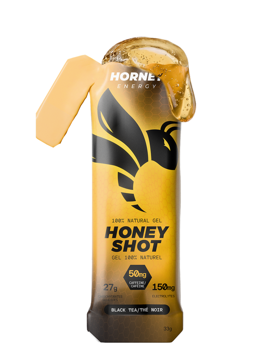Hornet Energy Honey Shot energy gel sachet in Black Tea flavour, 33 g, showing 50 mg caffeine and 27 g carbohydrates.