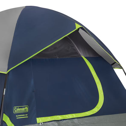 Coleman tent with blue and green design on a white background