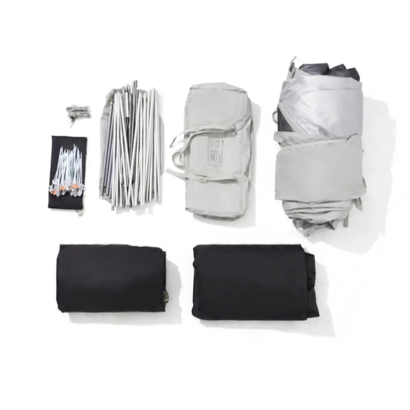 Set of camping gear including a tent, sleeping bags, and stakes on a white background