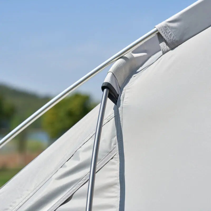 Close-up of a gray awning with a blurred outdoor background