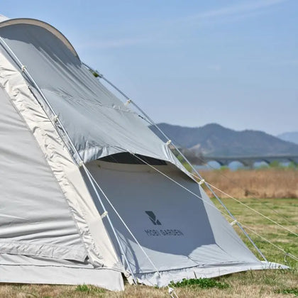 Camping tent with 'MOBI GARDEN' branding in a natural setting