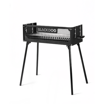 A black BLACKDOG outdoor folding grill with a closed lid, displayed on a white background.