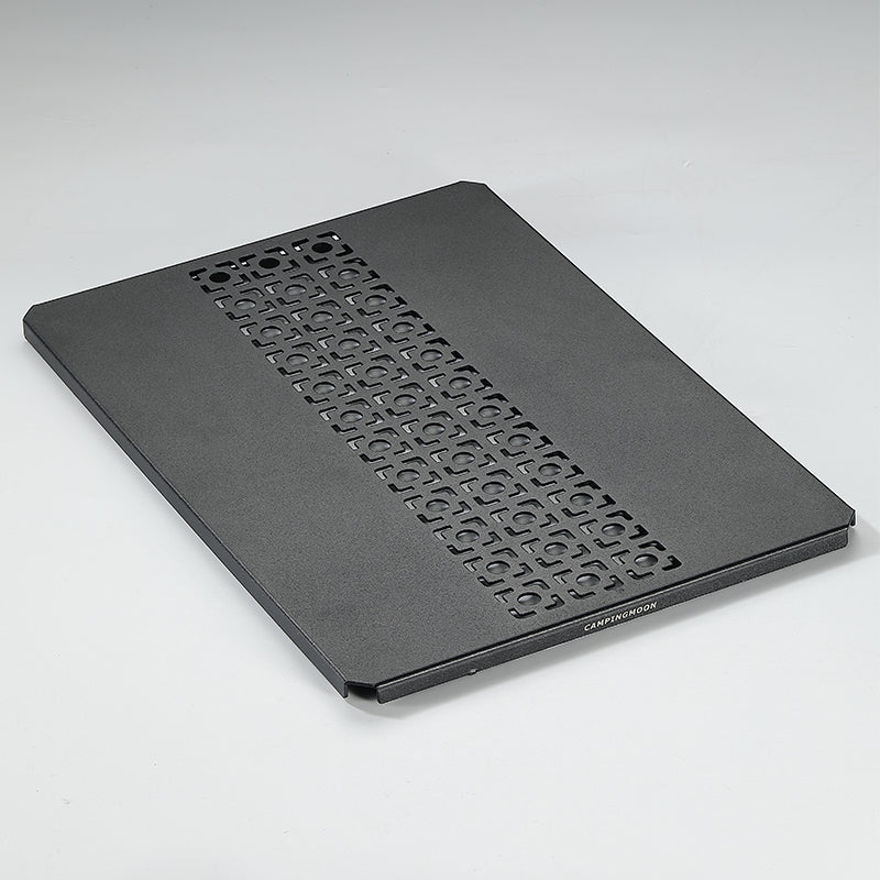 A black aluminum top board with a geometric pattern, designed for use with IGT grill tables and bridge tables.