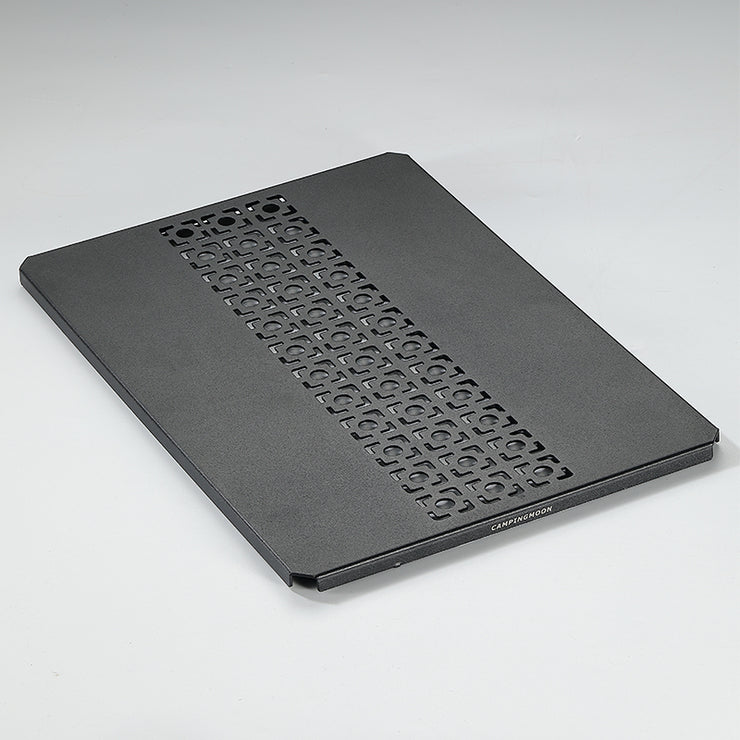 A black aluminum top board with a geometric pattern, designed for use with IGT grill tables and bridge tables.