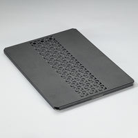 A black aluminum top board with a geometric pattern, designed for use with IGT grill tables and bridge tables.