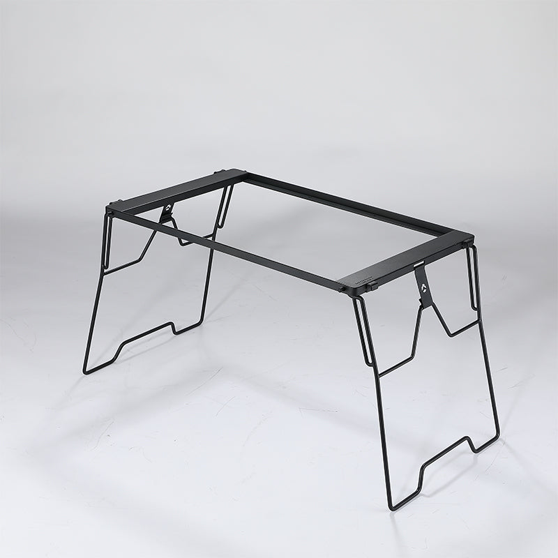 A black steel foldable camping table with a simple, sturdy design featuring four legs and a flat surface.
