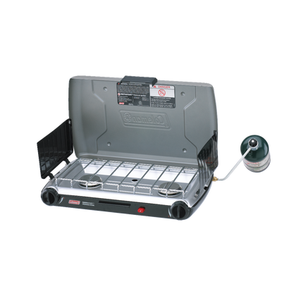 Coleman 2 Burner Triton Series Stove, open, with two burners and a windscreen.