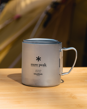 Snow Peak Ti-Double 450 Mug MG-153 in titanium with folding wire handle, studio white background
