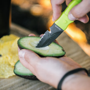 Gear Aid Akua Neon knife mounted on a PFD lash tab while paddling