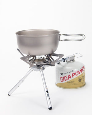 Snow Peak BiPod Stove GS-370 set up with a titanium pot on its arms and GigaPower canister attached