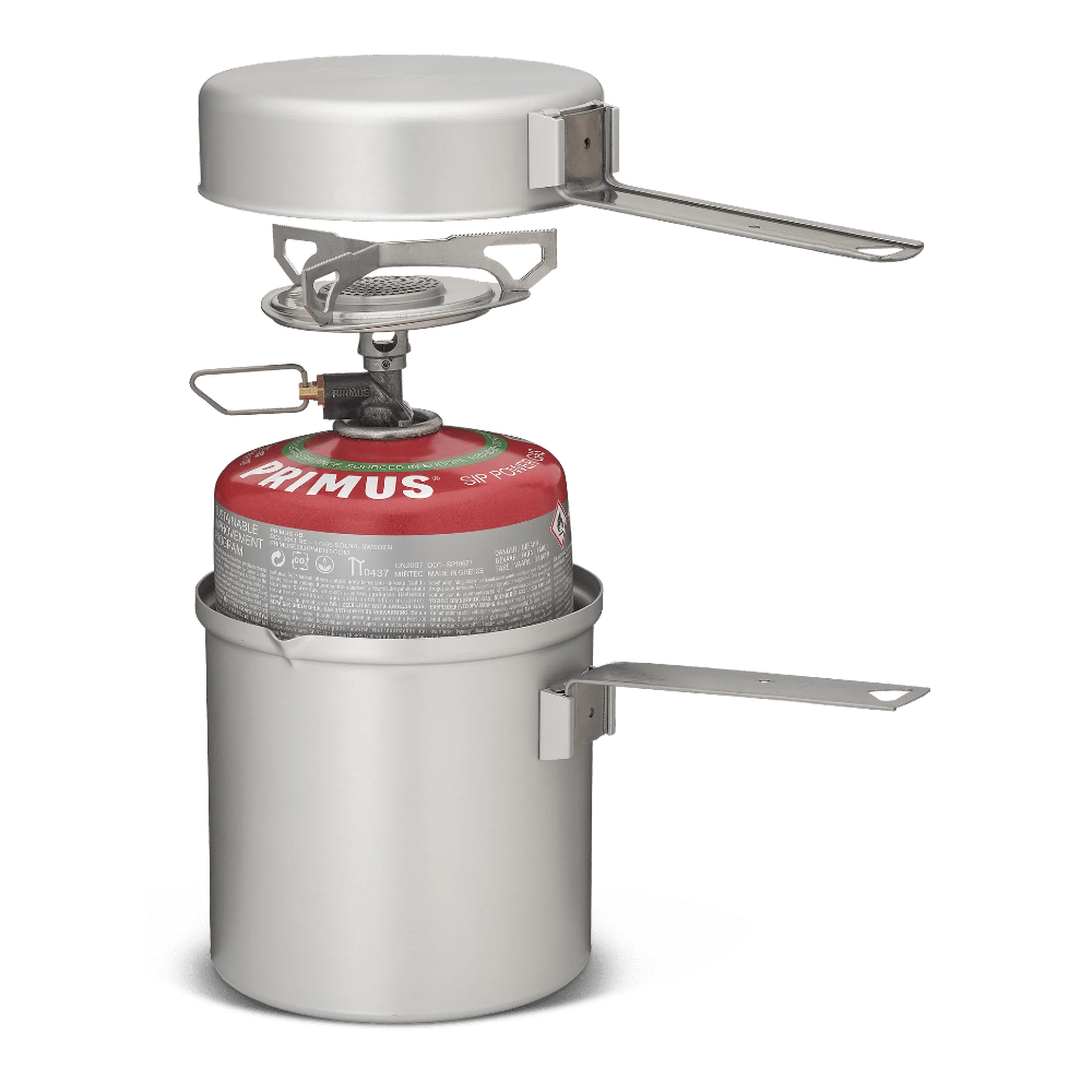 Primus Essential Trail Kit fully nested: stove, pot, lid, handles, and mesh storage bag
