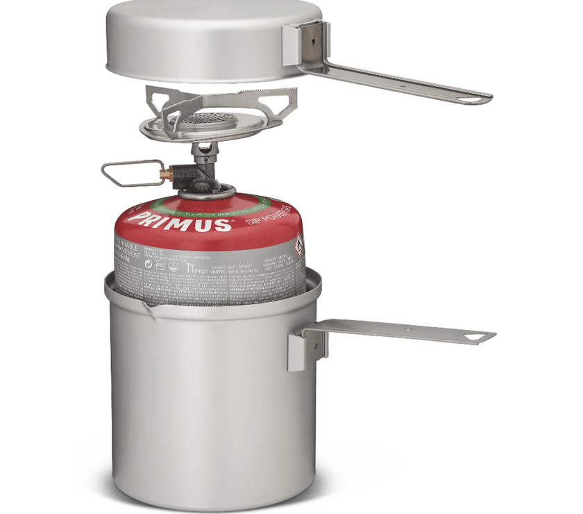Primus Essential Trail Kit fully nested: stove, pot, lid, handles, and mesh storage bag