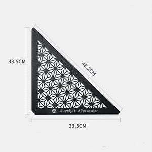 A black triangular ceiling panel with a geometric pattern, featuring the text 'Simply But Particular' on the bottom right corner. With dimension labeled on side 