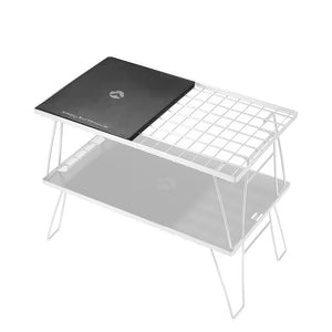 A matte black anodized aluminum camping table with a simple design and a logo in the center that reads 'Camping Moon'. The table is flat and appears sturdy with a slight texture. Put  on top of Camping Moon IGT table.