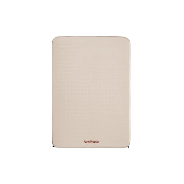 A beige, square-shaped self-inflating sleeping pad with the Naturehike brand logo visible.