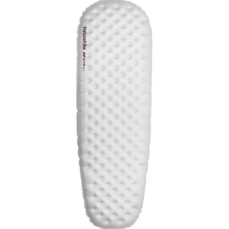 An inflatable mummy sleeping pad with a textured surface, primarily white in color.