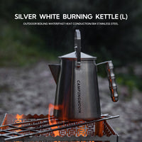 Kettle with heat-resistant handle pouring boiling water outdoors
